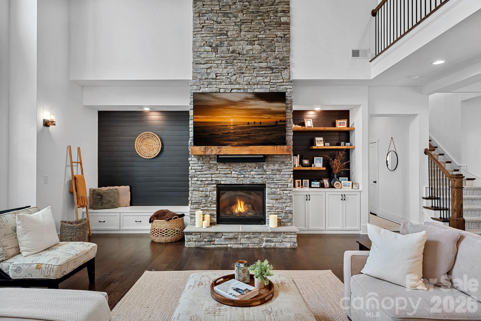 18401 Doves Crest Road Cornelius, NC 28031 - Photo 11 of 39 a living room with furniture and a fireplace
