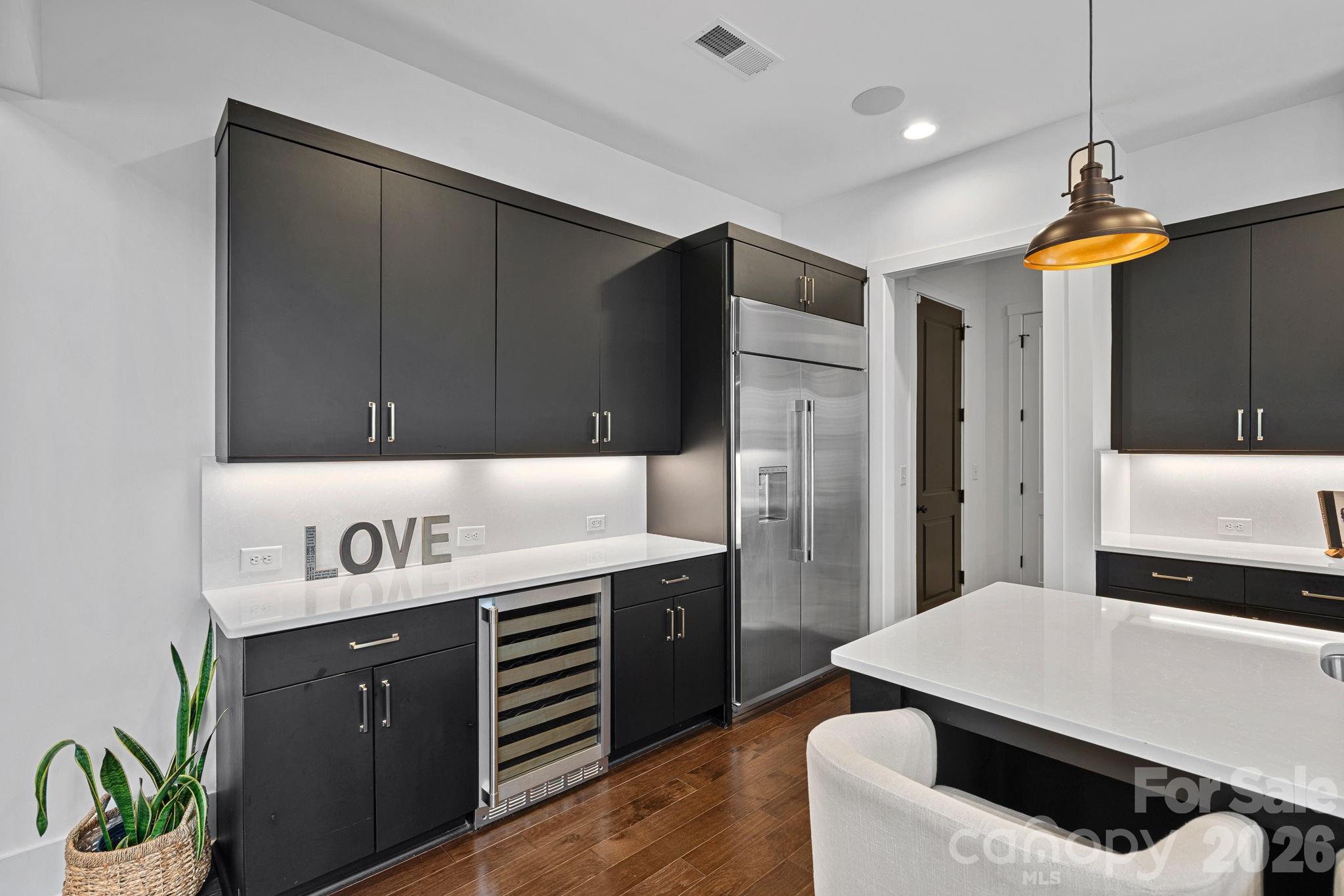 18401 Doves Crest Road Cornelius, NC 28031 - Photo 18 of 39 a kitchen with a sink appliances and cabinets