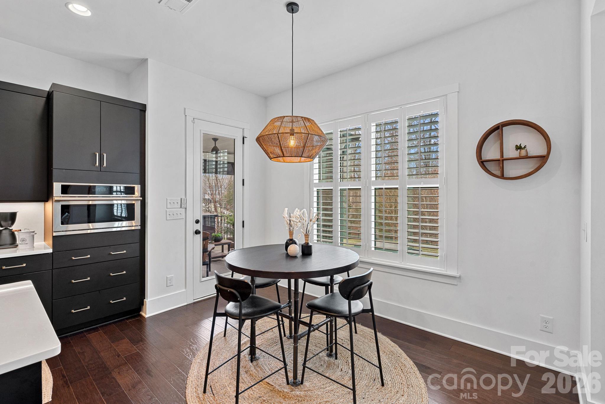 18401 Doves Crest Road Cornelius, NC 28031 - Photo 19 of 39 a dining room with furniture and window