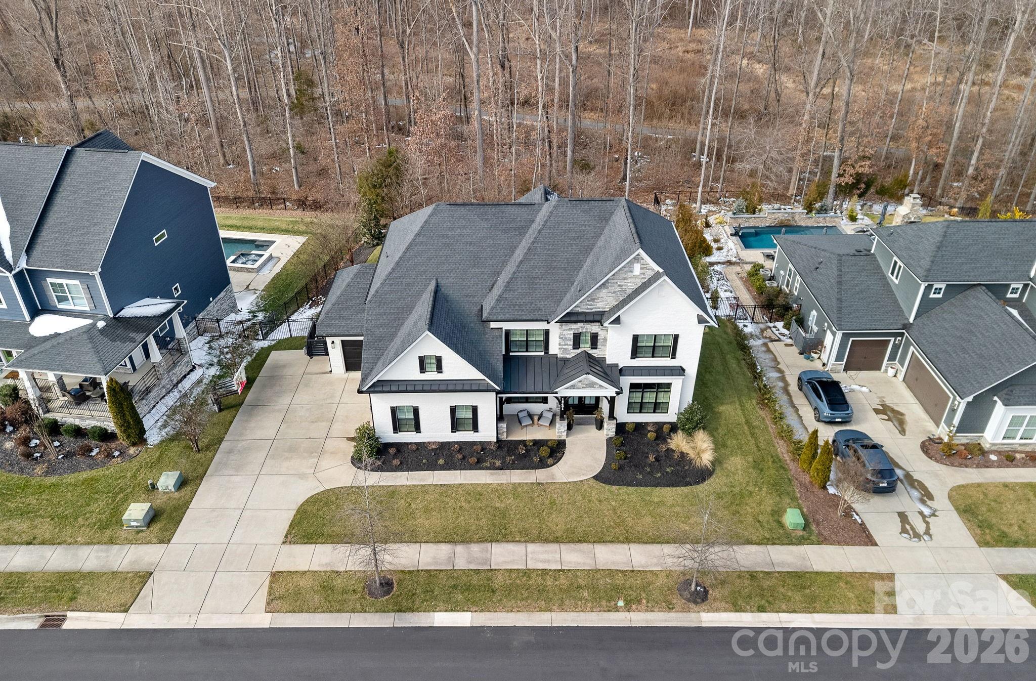 18401 Doves Crest Road Cornelius, NC 28031 - Photo 2 of 39 an aerial view of a house with swimming pool