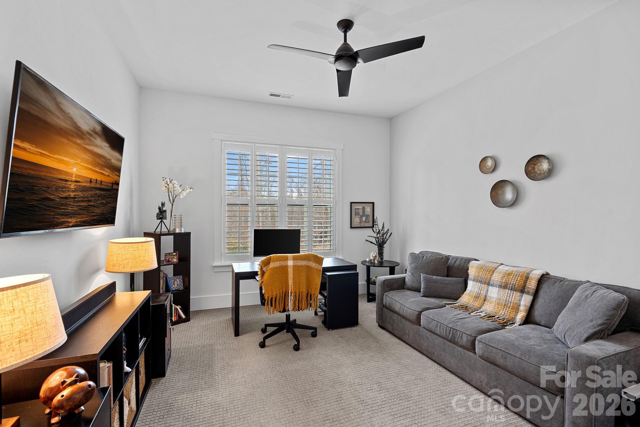 18401 Doves Crest Road Cornelius, NC 28031 - Photo 21 of 39 a view of a livingroom with workspace and a couch
