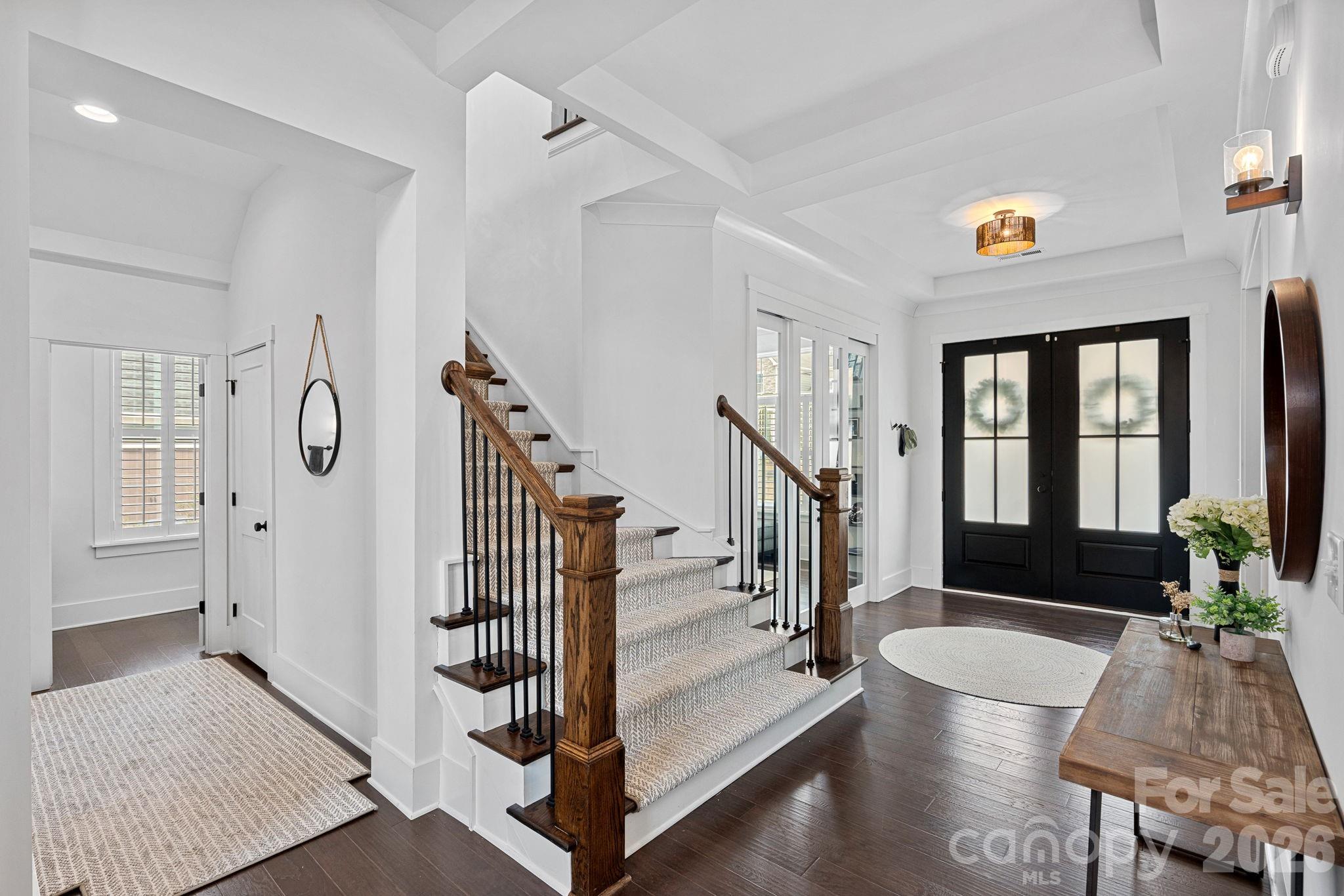 18401 Doves Crest Road Cornelius, NC 28031 - Photo 23 of 39 a view of entryway livingroom and hall with wooden floor