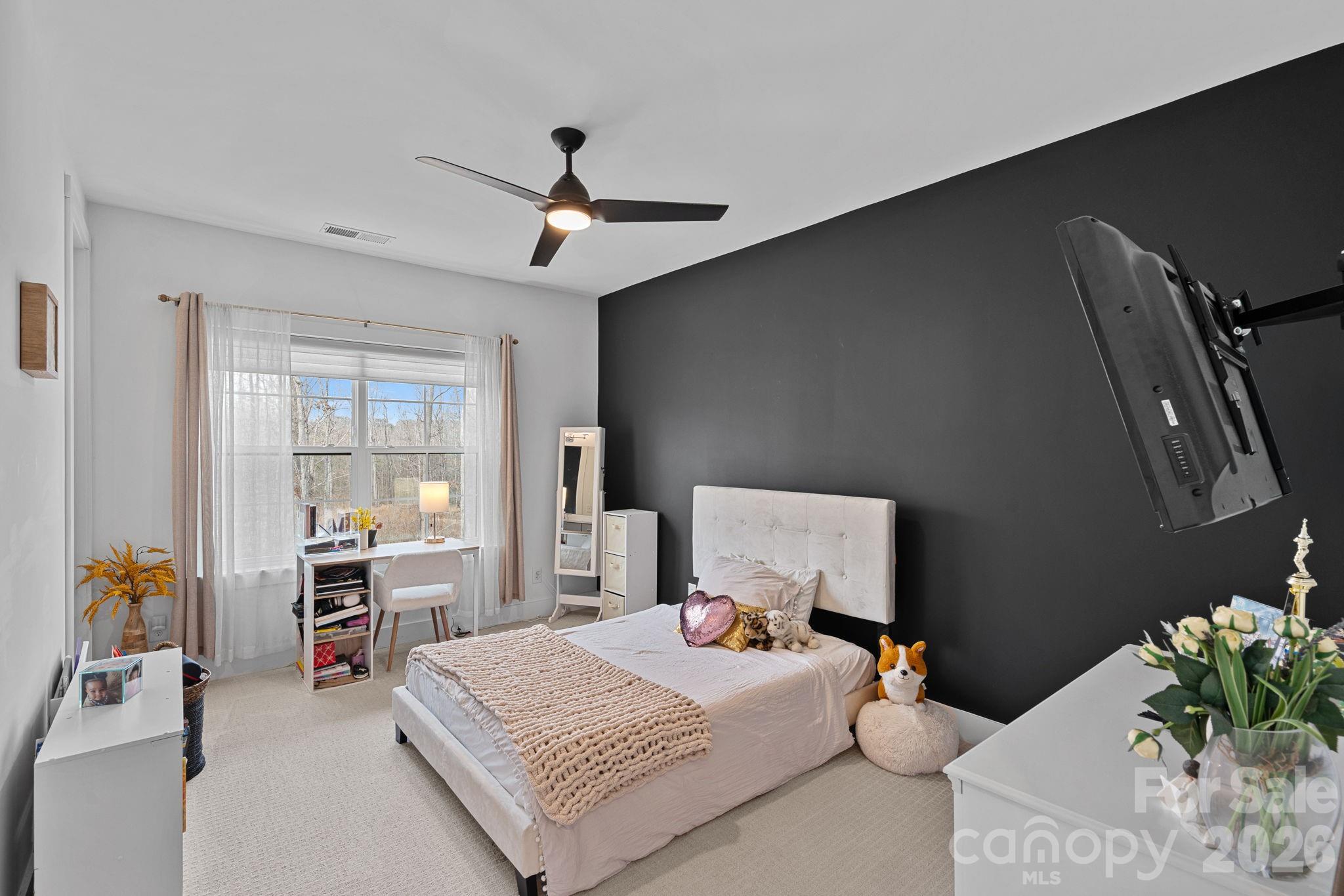 18401 Doves Crest Road Cornelius, NC 28031 - Photo 27 of 39 a bedroom with a bed and furniture