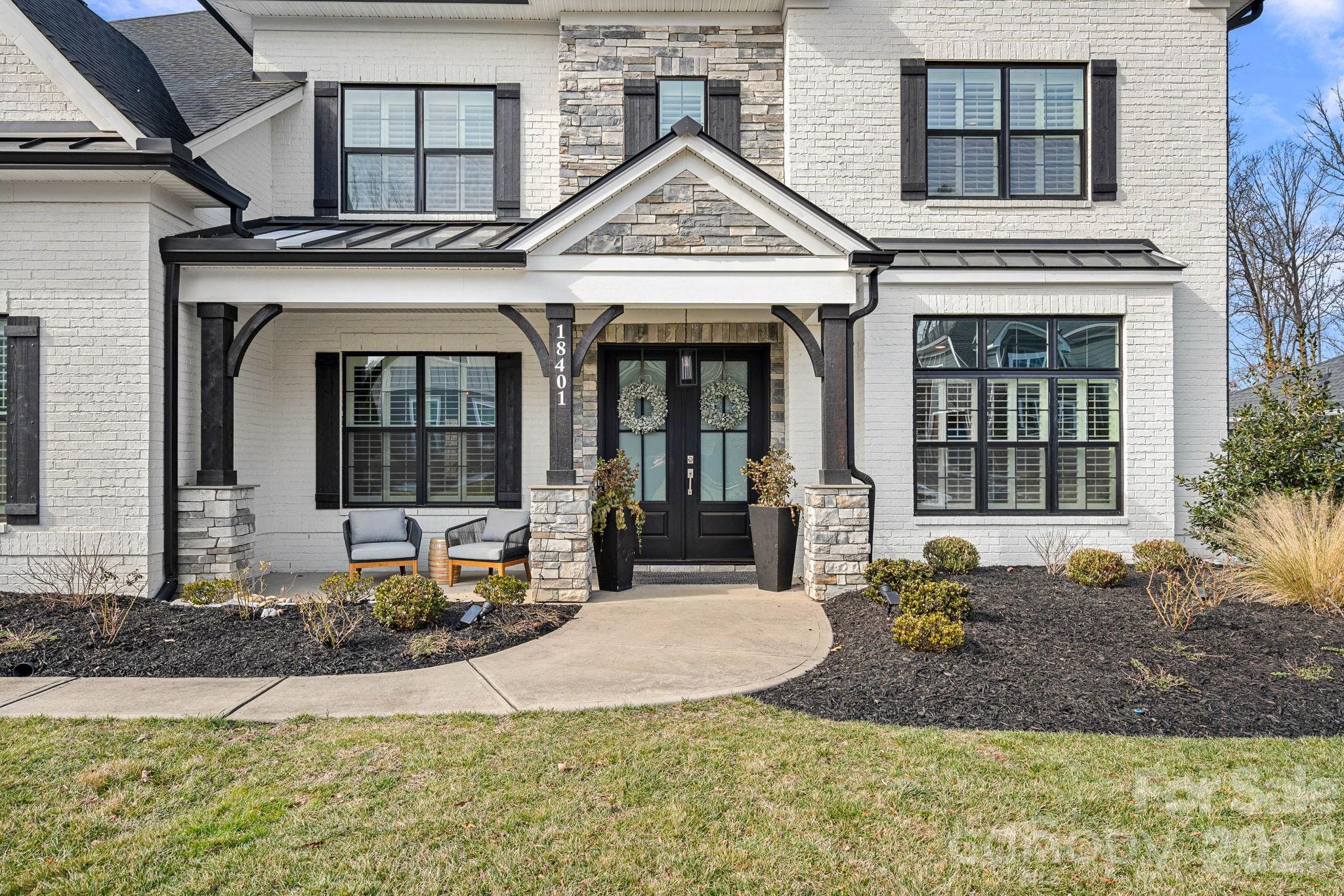 18401 Doves Crest Road Cornelius, NC 28031 - Photo 4 of 39 a front view of a house