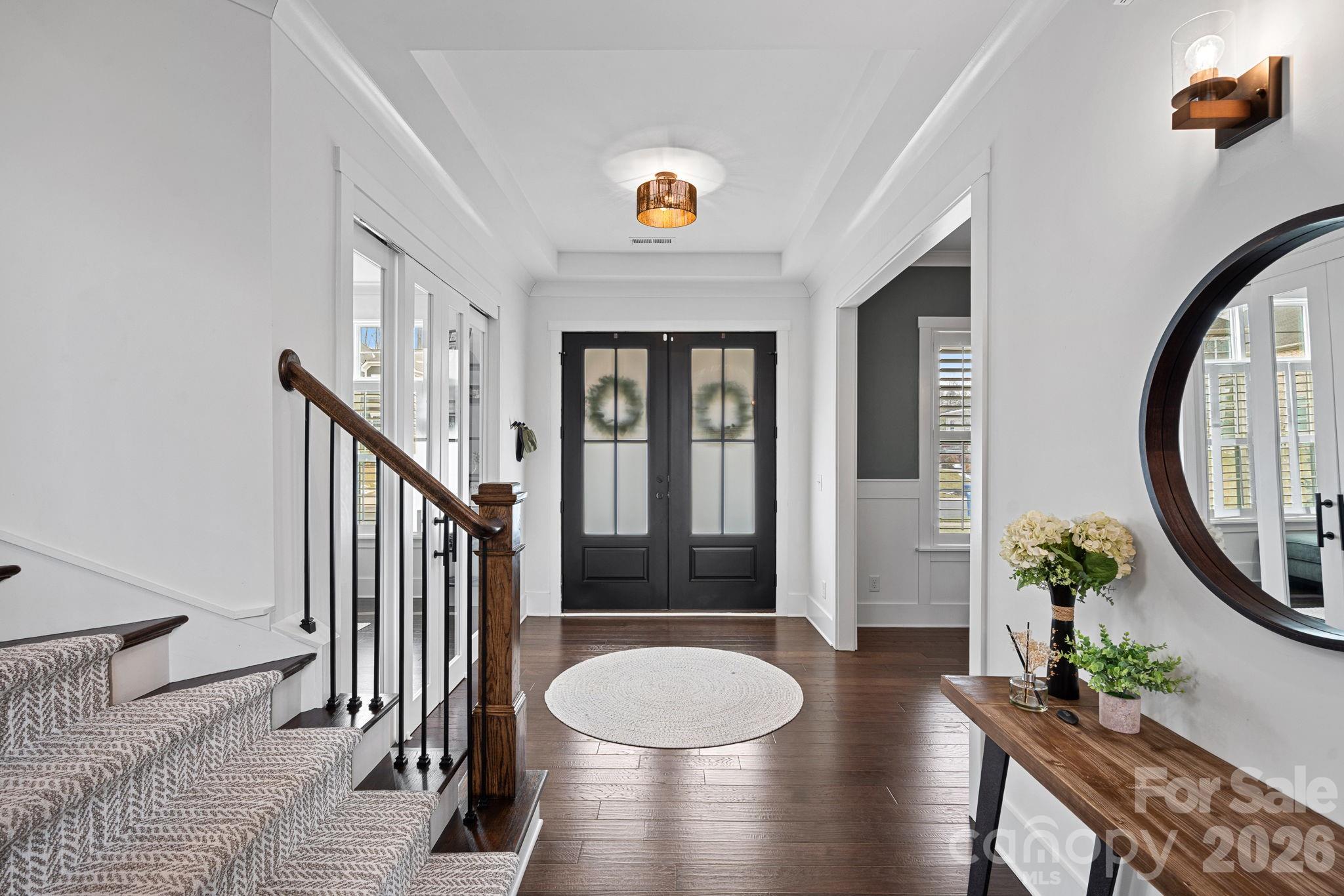 18401 Doves Crest Road Cornelius, NC 28031 - Photo 6 of 39 a view of a hallway with furniture and wooden floor