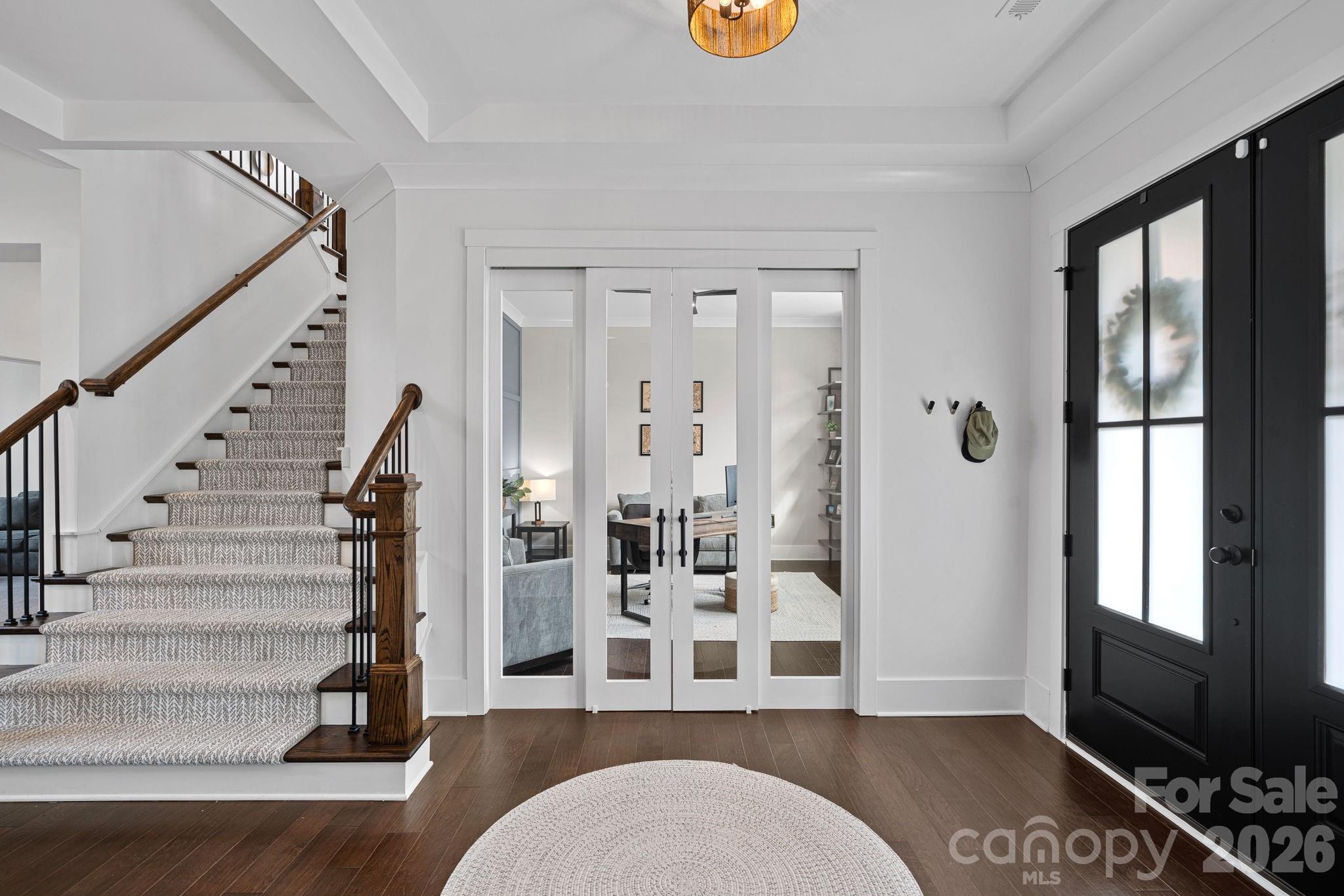 18401 Doves Crest Road Cornelius, NC 28031 - Photo 7 of 39 a living room with furniture a rug and a large window