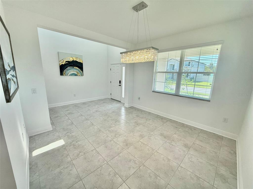 12189 Nouveau Avenue Spring Hill, FL 34610 - Photo 11 of 50 a view of an empty room with a window