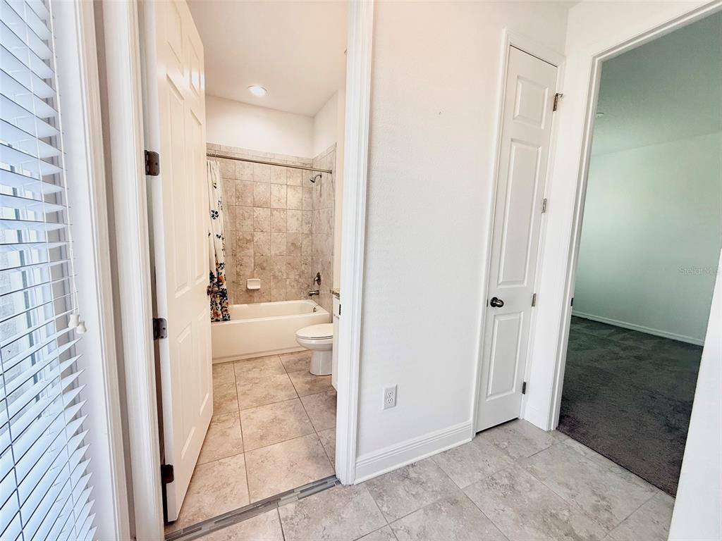 12189 Nouveau Avenue Spring Hill, FL 34610 - Photo 21 of 50 a view of bathroom with tub shower and sink