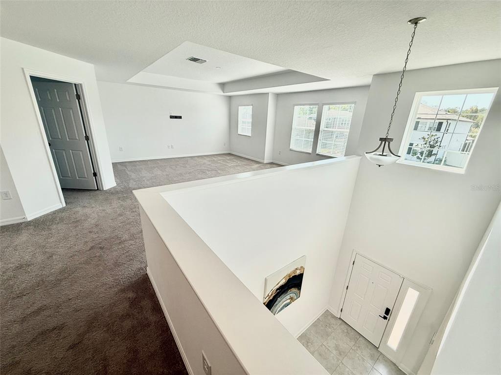 12189 Nouveau Avenue Spring Hill, FL 34610 - Photo 25 of 50 a view of an entryway with kitchen