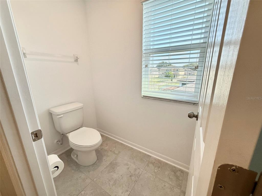 12189 Nouveau Avenue Spring Hill, FL 34610 - Photo 27 of 50 a bathroom with a toilet