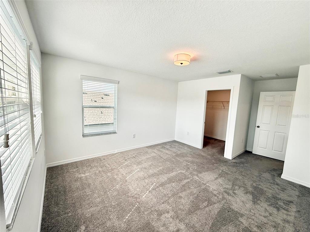 12189 Nouveau Avenue Spring Hill, FL 34610 - Photo 35 of 50 an empty room with windows and closet