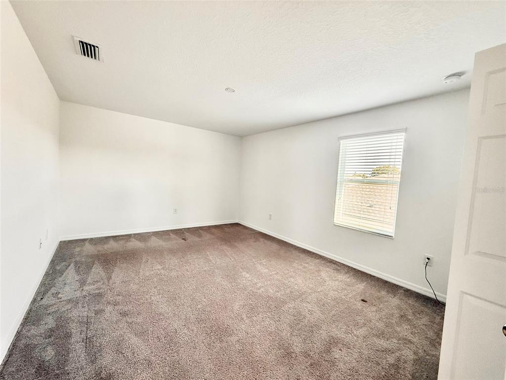 12189 Nouveau Avenue Spring Hill, FL 34610 - Photo 40 of 50 an empty room with a window