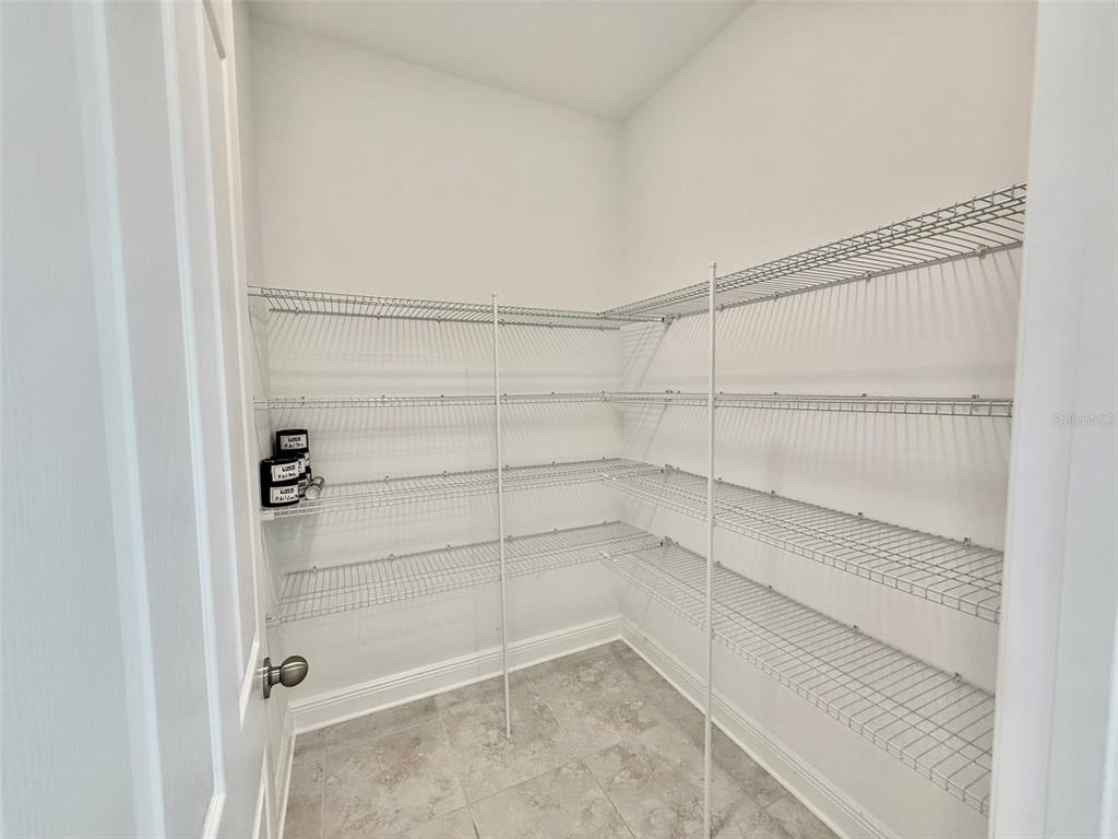 12189 Nouveau Avenue Spring Hill, FL 34610 - Photo 41 of 50 a view of a room with shelf