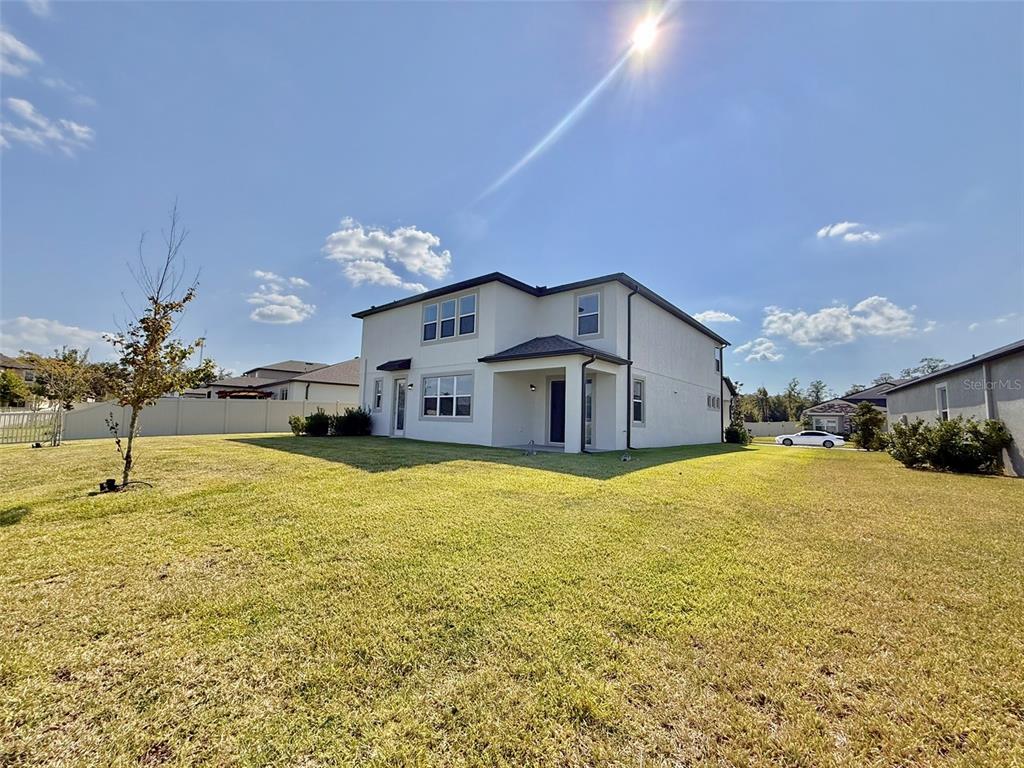 12189 Nouveau Avenue Spring Hill, FL 34610 - Photo 45 of 50 a house view with swimming pool in front of it