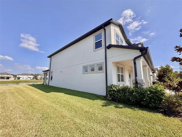 a view of a lake with houses in the background
