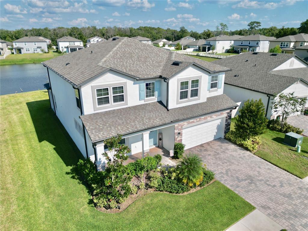 12189 Nouveau Avenue Spring Hill, FL 34610 - Photo 5 of 50 an aerial view of a house with a yard