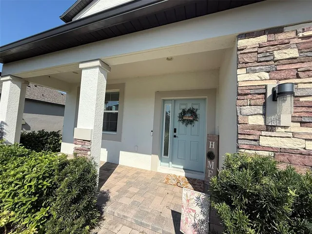 a front view of a house with a porch