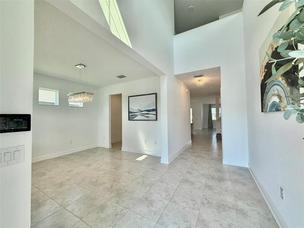 12189 Nouveau Avenue Spring Hill, FL 34610 - Photo 9 of 50 a view of a hallway with entryway to other door