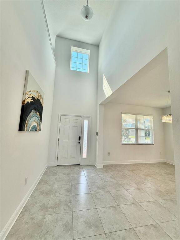 12189 Nouveau Avenue Spring Hill, FL 34610 - Photo 10 of 50 an empty room with windows and closet