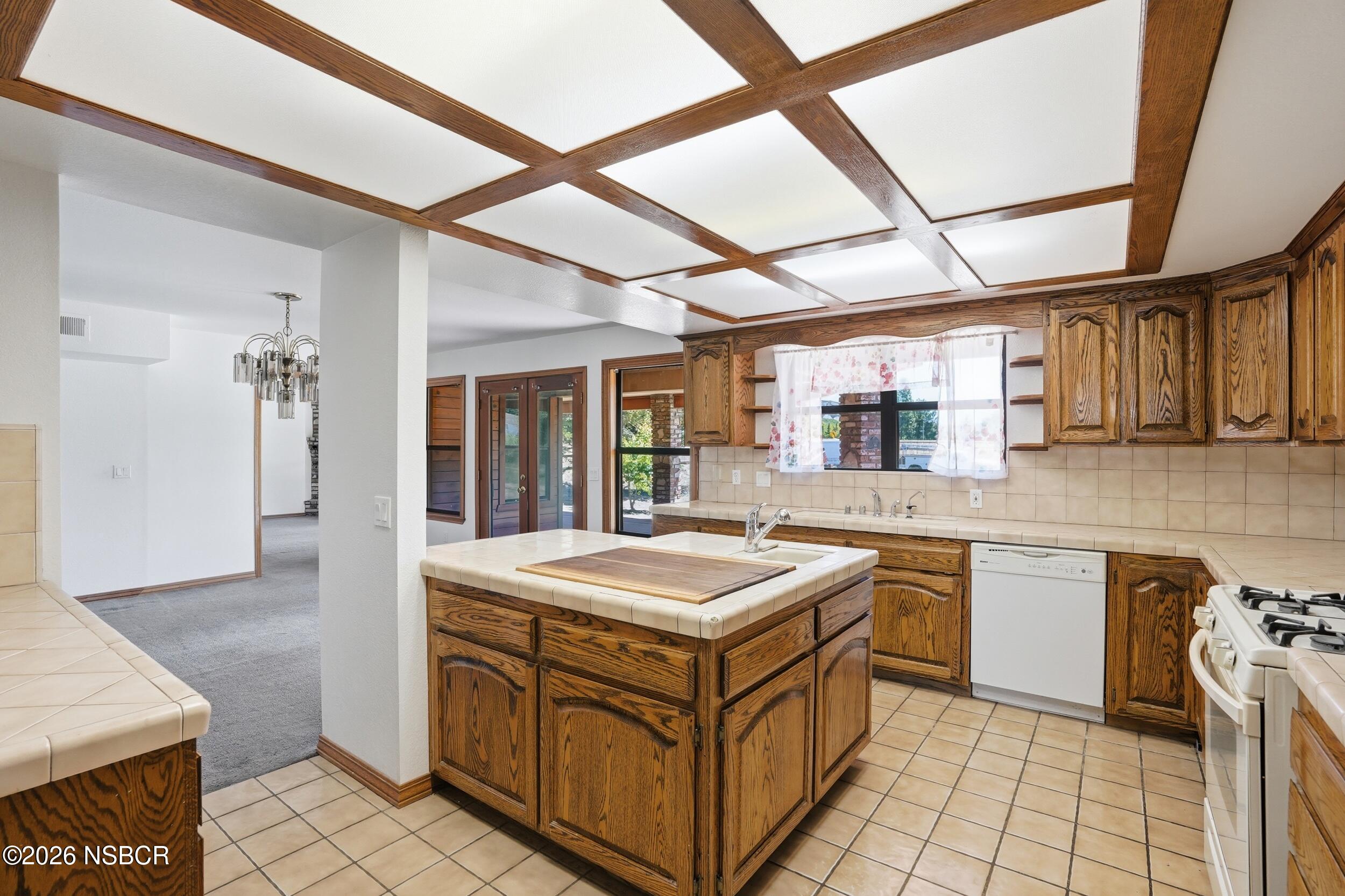 140 East Rice Ranch Road Santa Maria, CA 93455 - Photo 15 of 44 a kitchen with a sink stove and cabinets