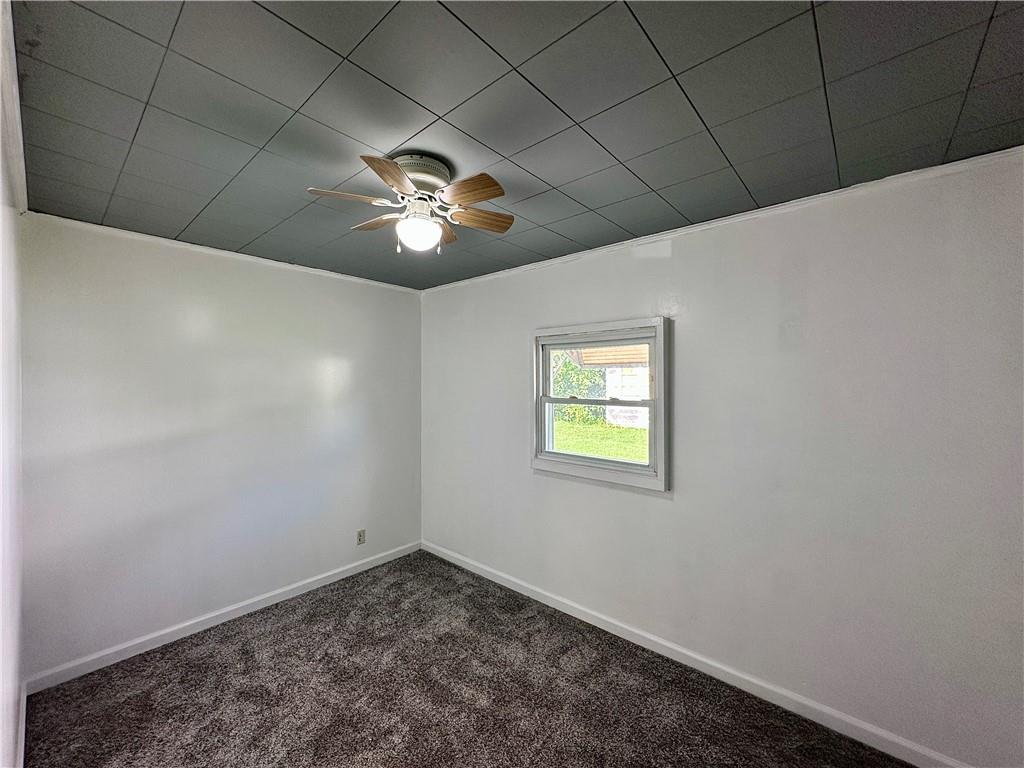 1920 Robinwood Street New Castle, PA 16101 - Photo 11 of 16 a view of empty room with a window and a fireplace