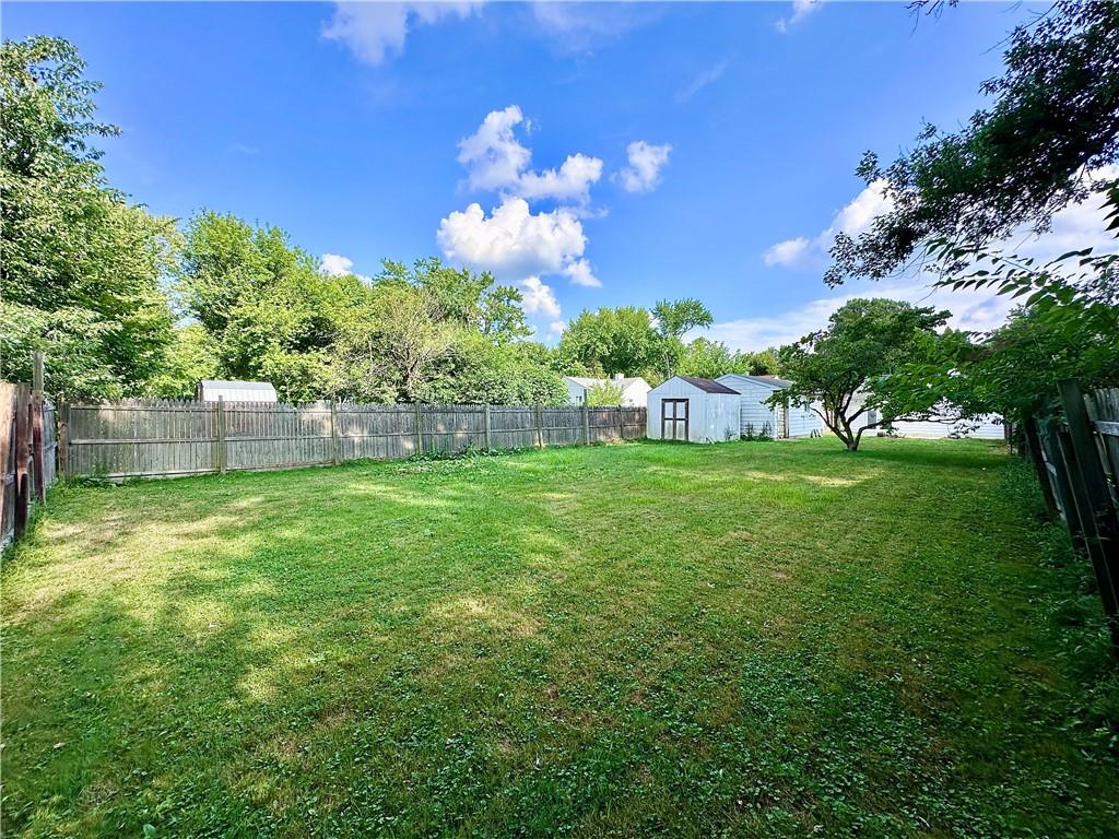 1920 Robinwood Street New Castle, PA 16101 - Photo 15 of 16 a view of a house with a big yard potted plants and large tree