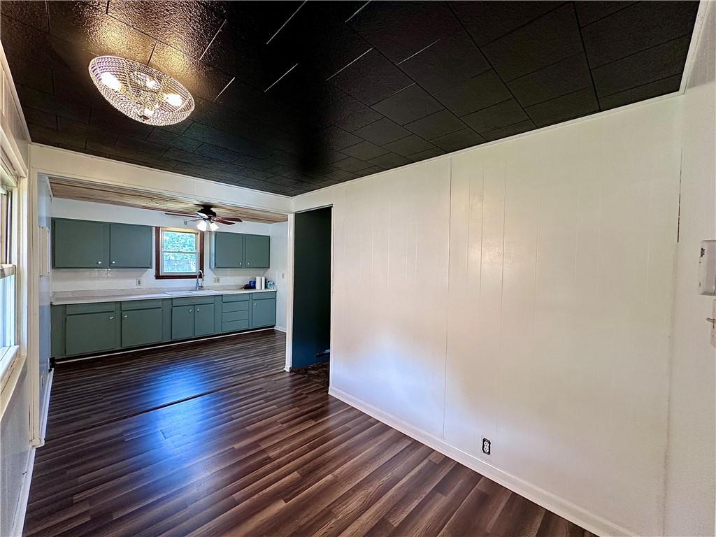1920 Robinwood Street New Castle, PA 16101 - Photo 3 of 16 a view of an empty room with wooden floor and a window
