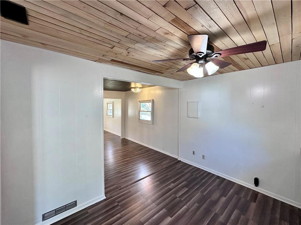 1920 Robinwood Street New Castle, PA 16101 - Photo 5 of 16 a view of an empty room with a window and wooden floor