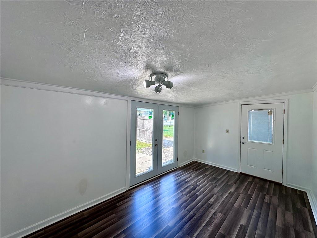 1920 Robinwood Street New Castle, PA 16101 - Photo 7 of 16 wooden floor in an empty room with a window
