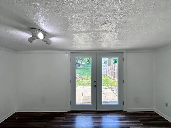 a room with window and wooden floor