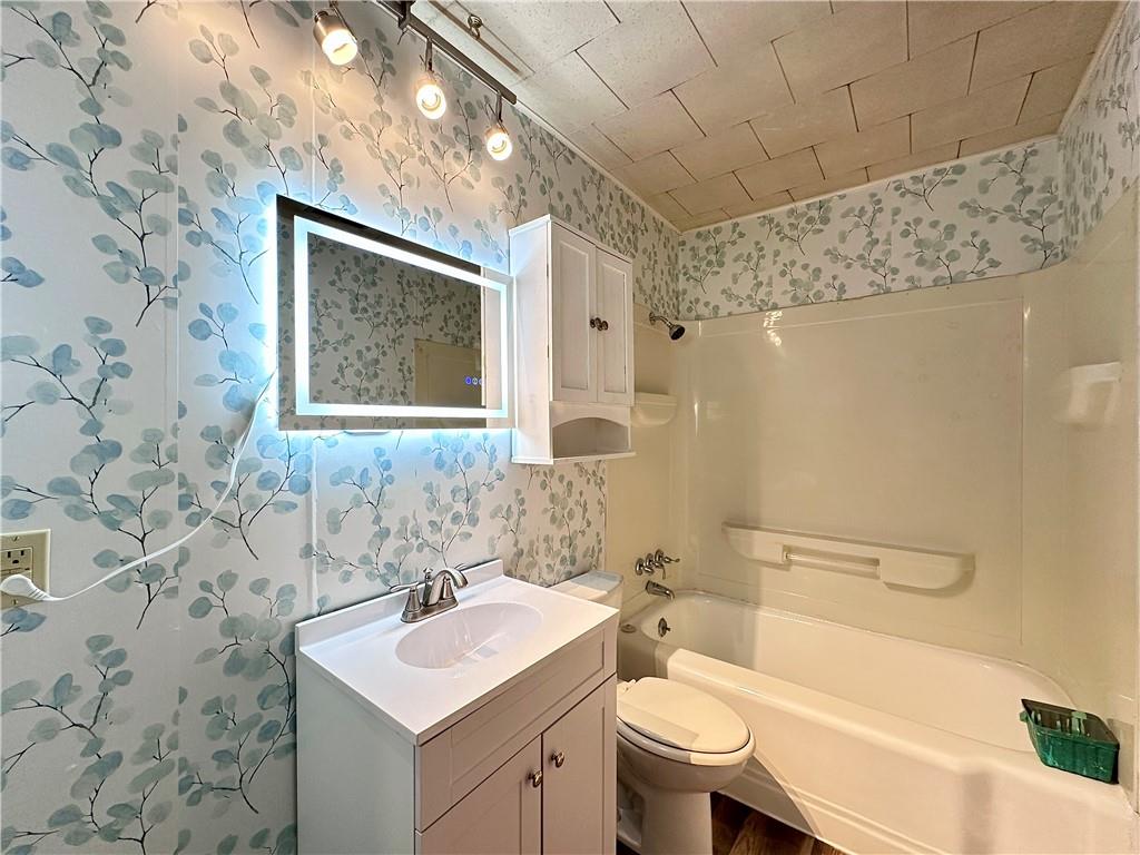 1920 Robinwood Street New Castle, PA 16101 - Photo 10 of 16 a bathroom with a sink toilet vanity and shower