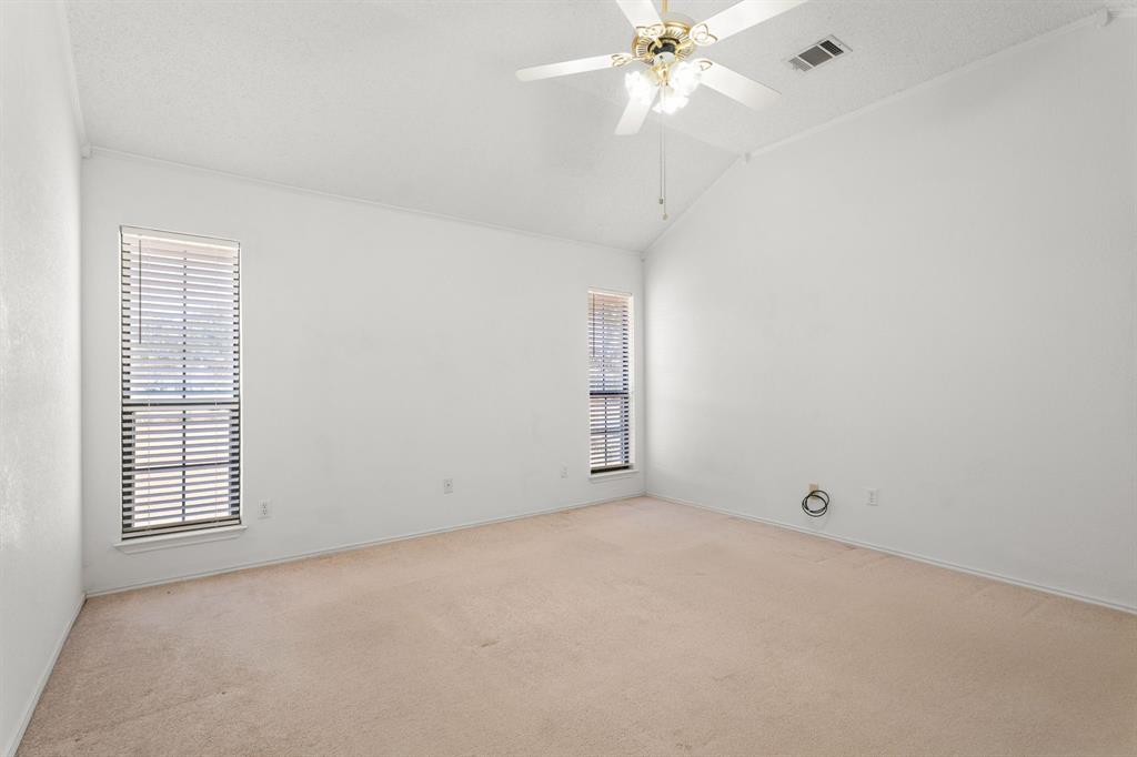 162 Warren Road Lorena, TX 76655 - Photo 20 of 39 Vaulted ceiling, two windows with blinds, ceiling fan, carpeted flooring