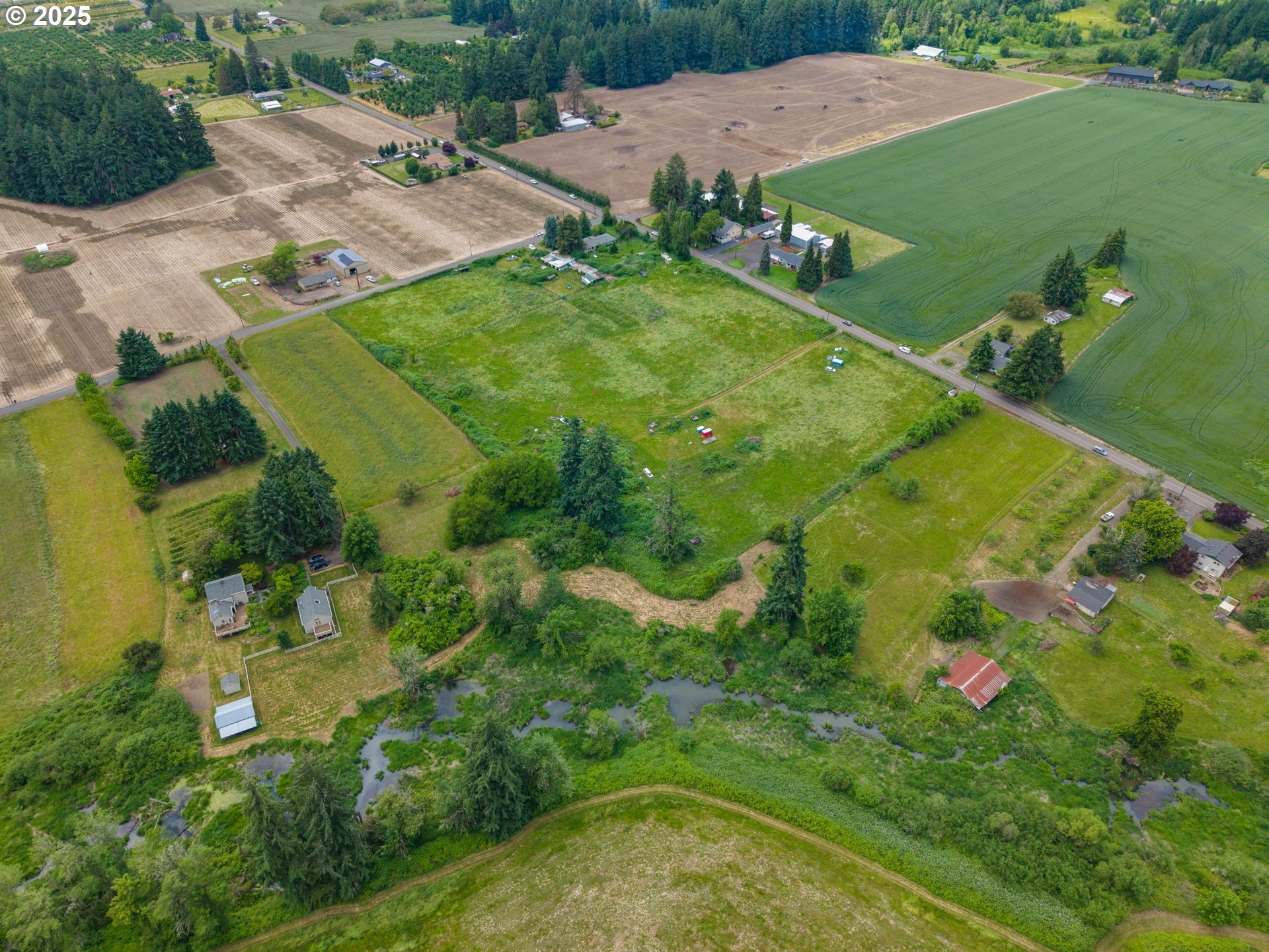 7044 Southwest Jacktown Road Beaverton, OR 97078 - Photo 8 of 14 an aerial view of residential houses with outdoor space and trees