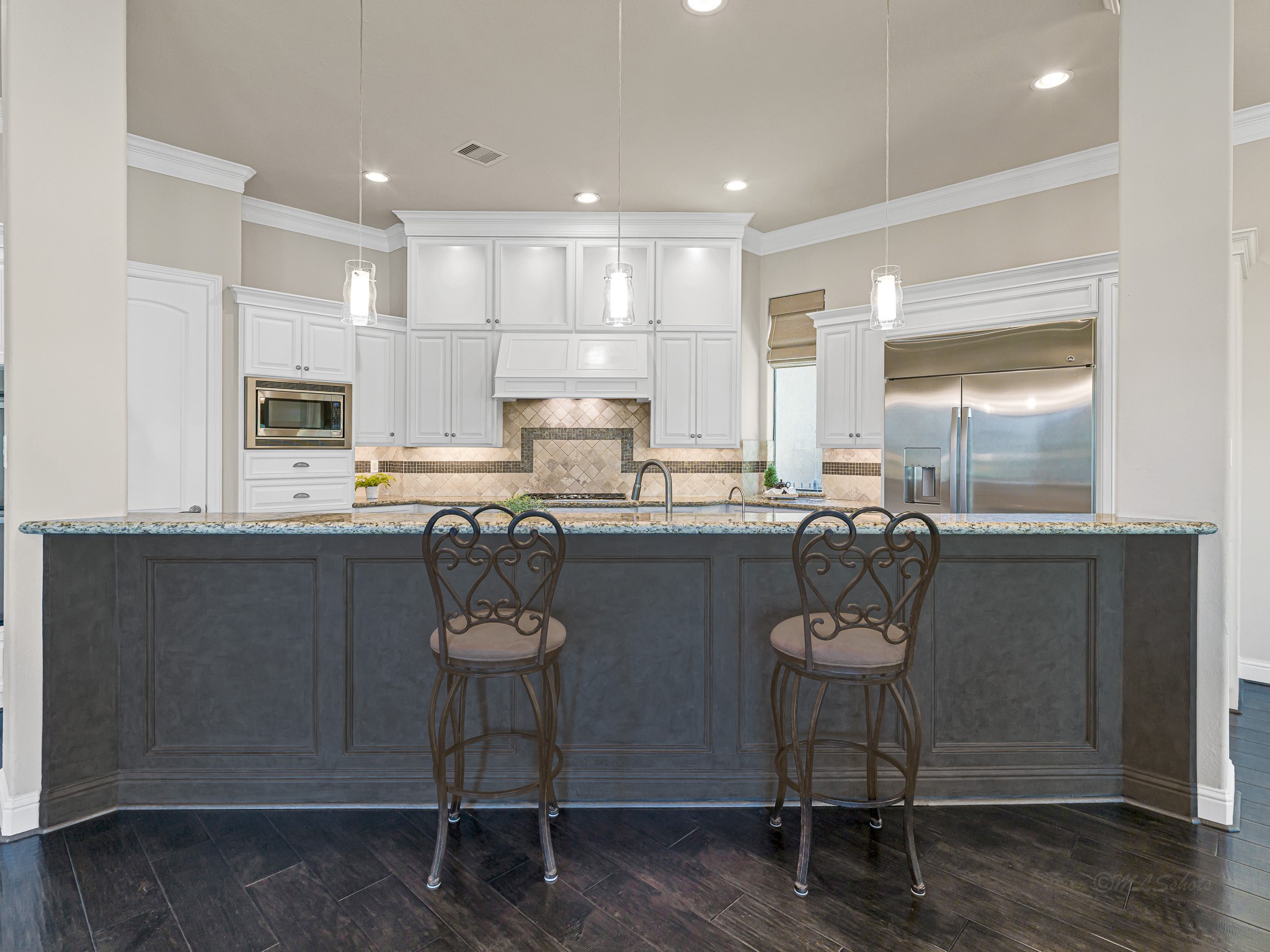 1802 Sparrows Ridge Katy, TX 77450 - Photo 19 of 50 a kitchen with stainless steel appliances a dining table chairs and refrigerator