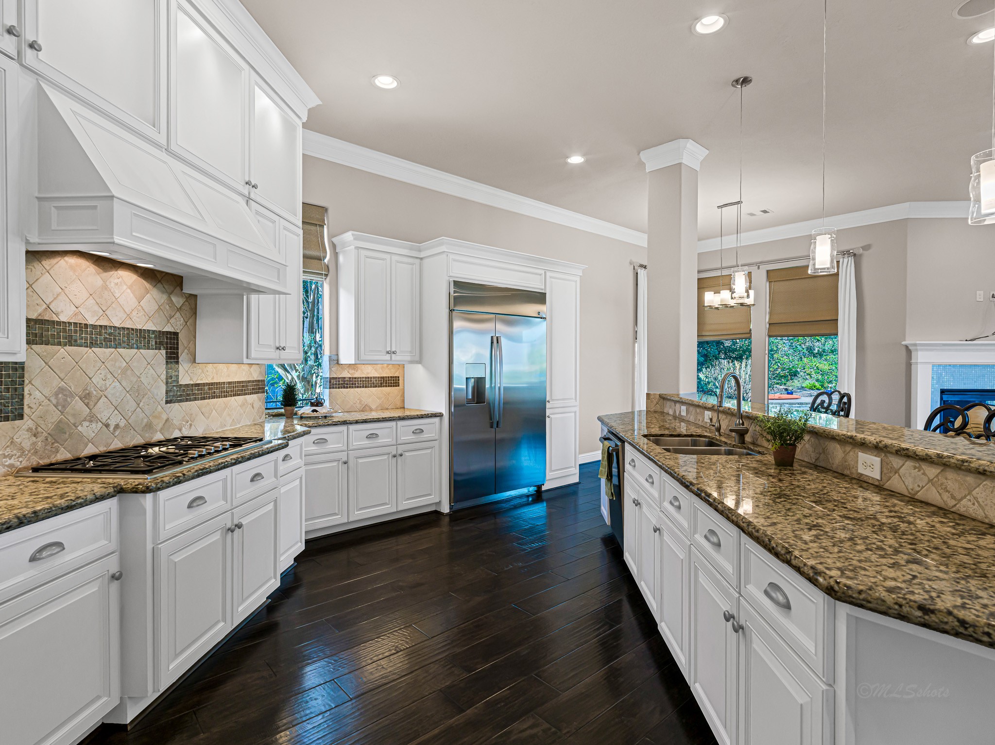 1802 Sparrows Ridge Katy, TX 77450 - Photo 22 of 50 a large kitchen with granite countertop lots of counter space and sink