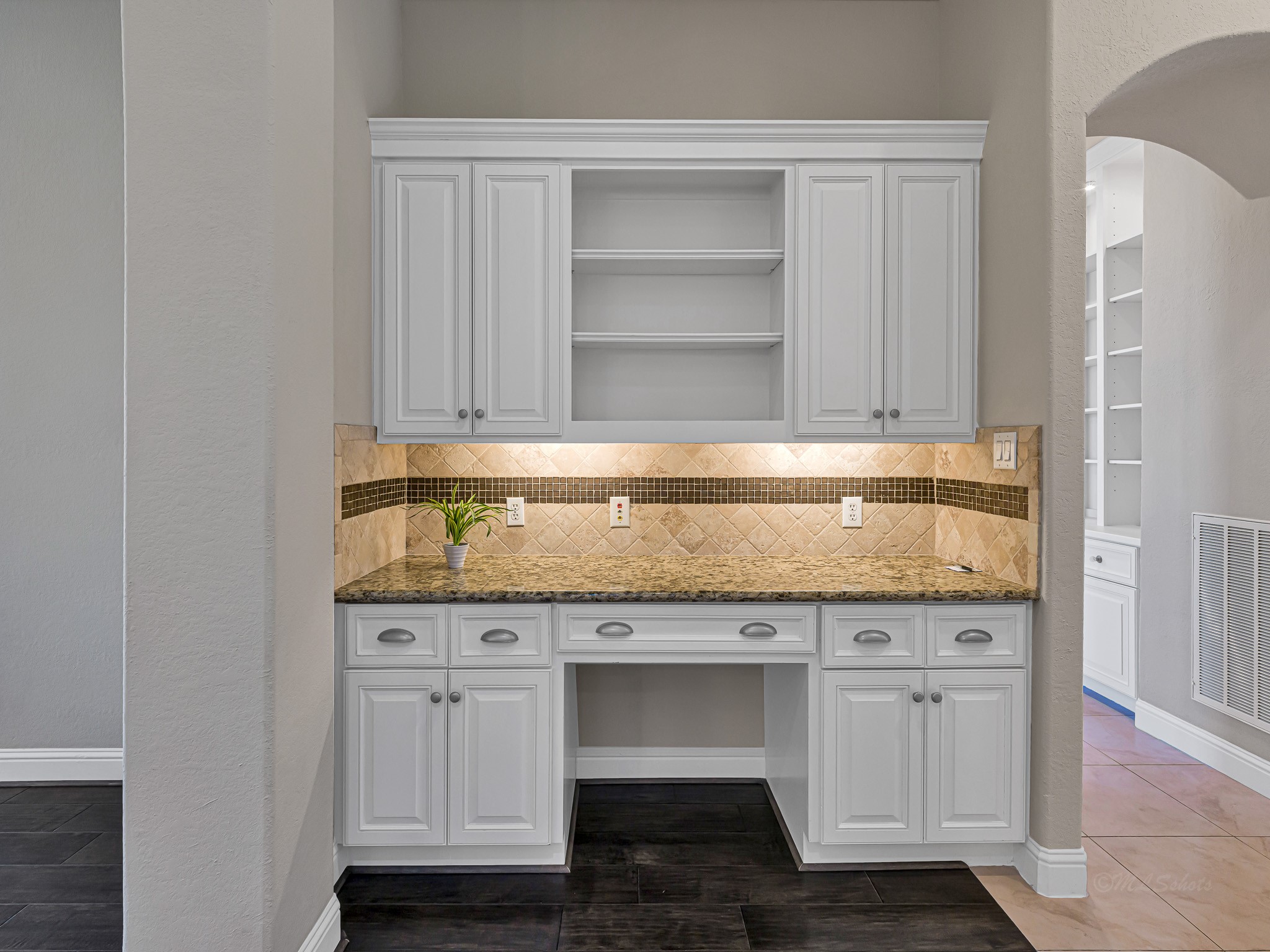 1802 Sparrows Ridge Katy, TX 77450 - Photo 23 of 50 a view of cabinets with wooden floor