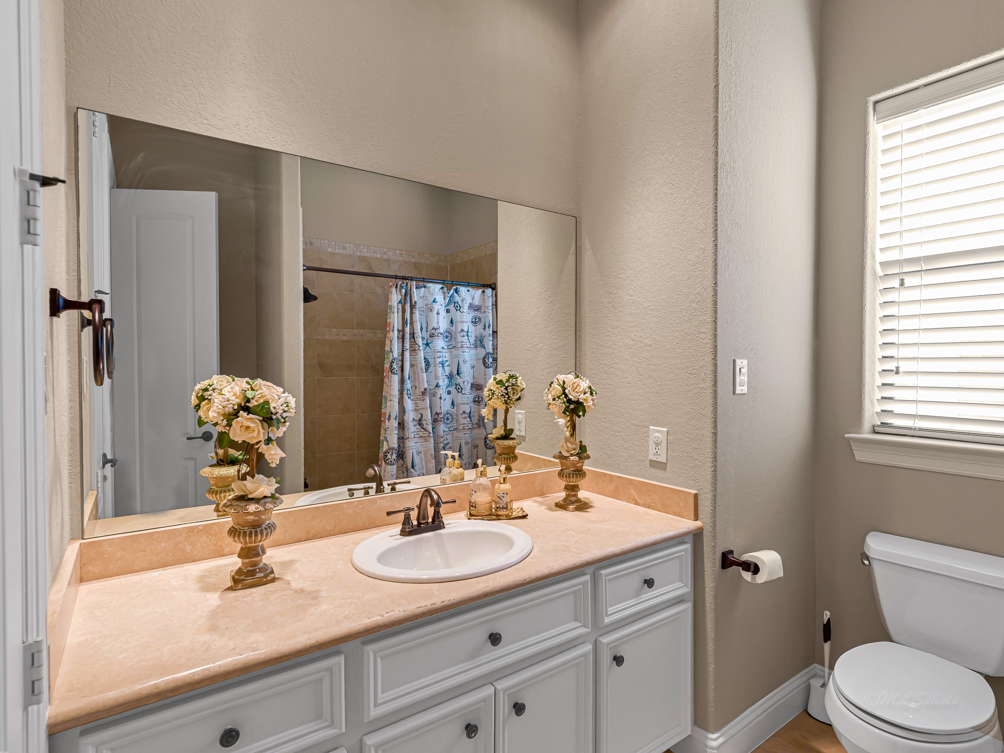 1802 Sparrows Ridge Katy, TX 77450 - Photo 25 of 50 a bathroom with a toilet sink and mirror