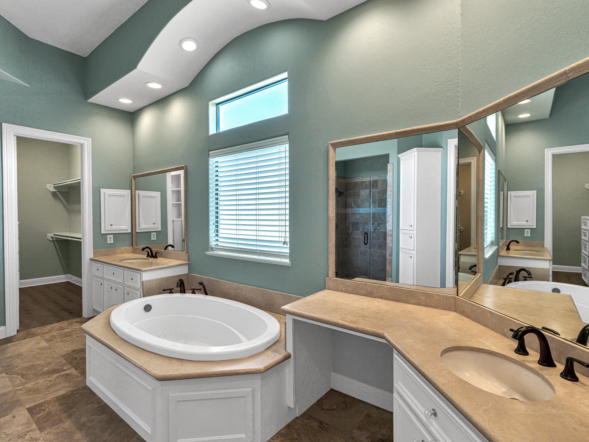 1802 Sparrows Ridge Katy, TX 77450 - Photo 31 of 50 a bathroom with a granite countertop tub sink a mirror and a bathtub