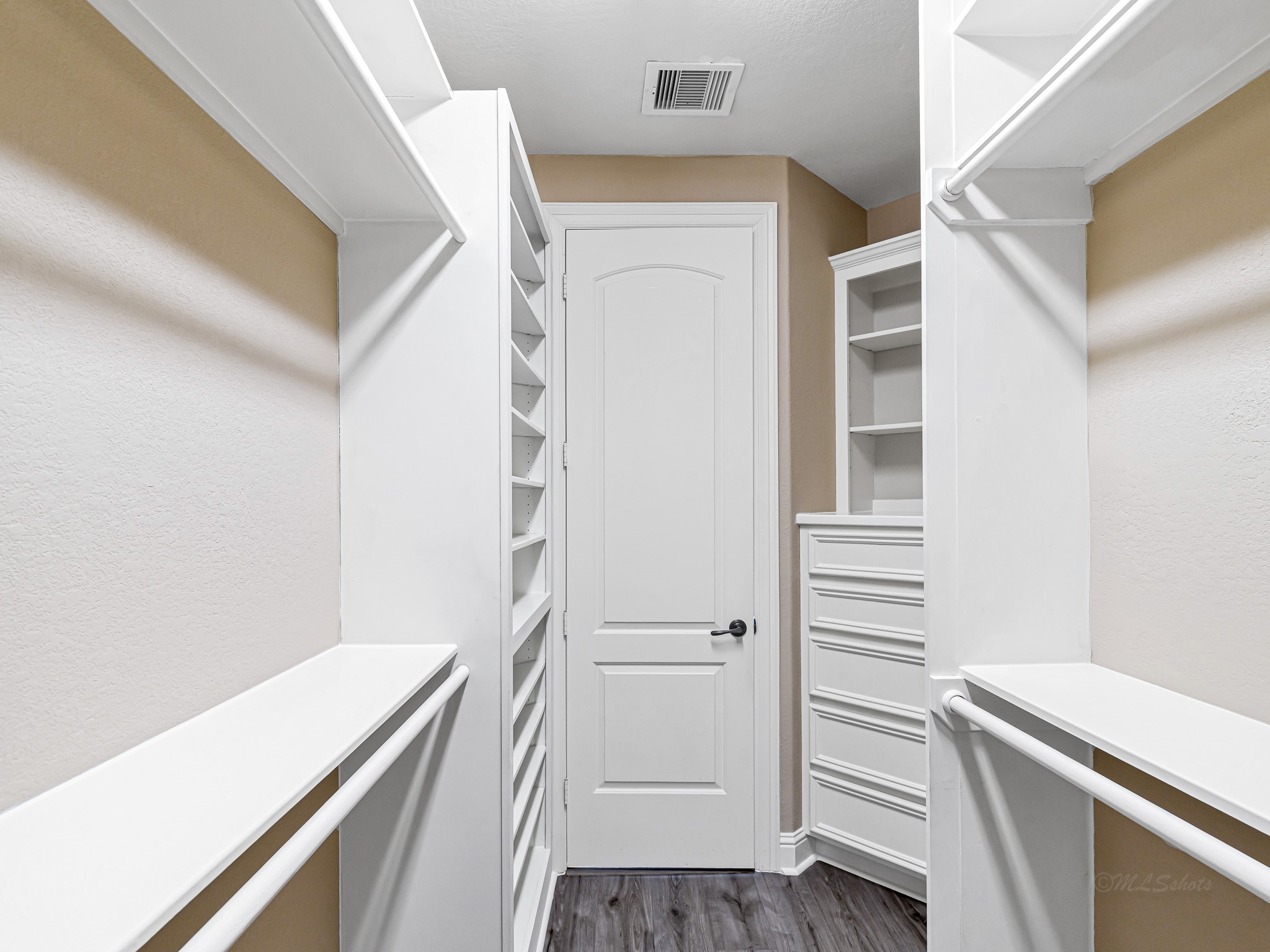 1802 Sparrows Ridge Katy, TX 77450 - Photo 33 of 50 a view of a hallway with closet and wooden floor