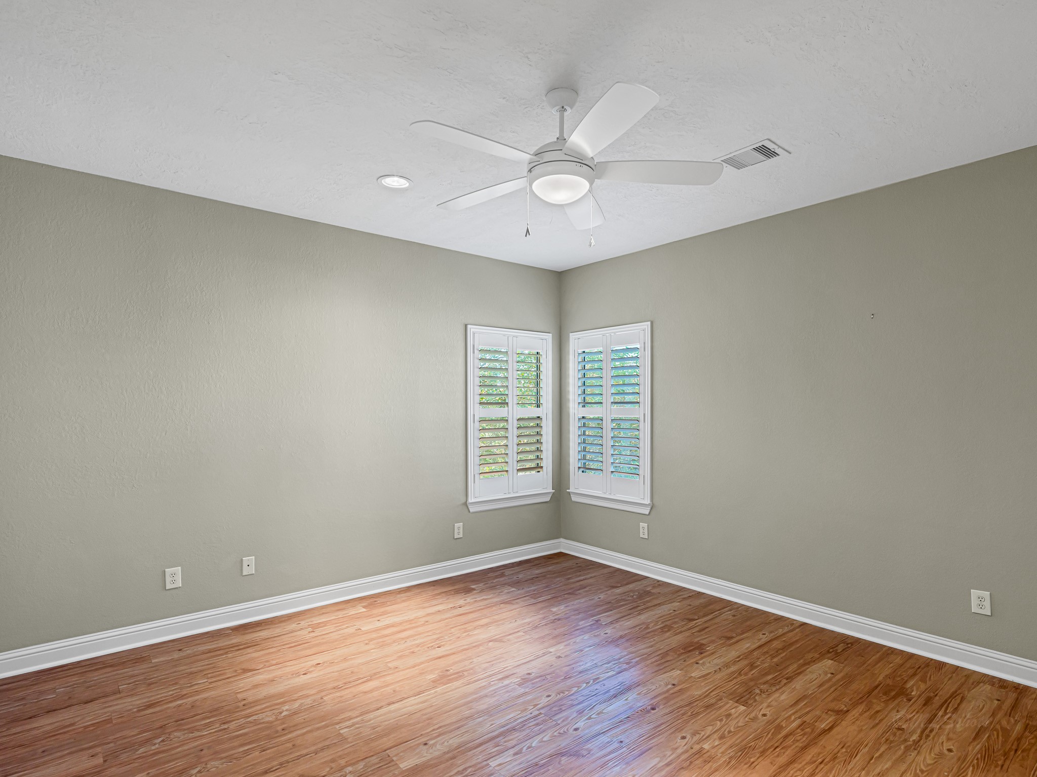 1802 Sparrows Ridge Katy, TX 77450 - Photo 40 of 50 a view of an empty room with wooden floor and a window