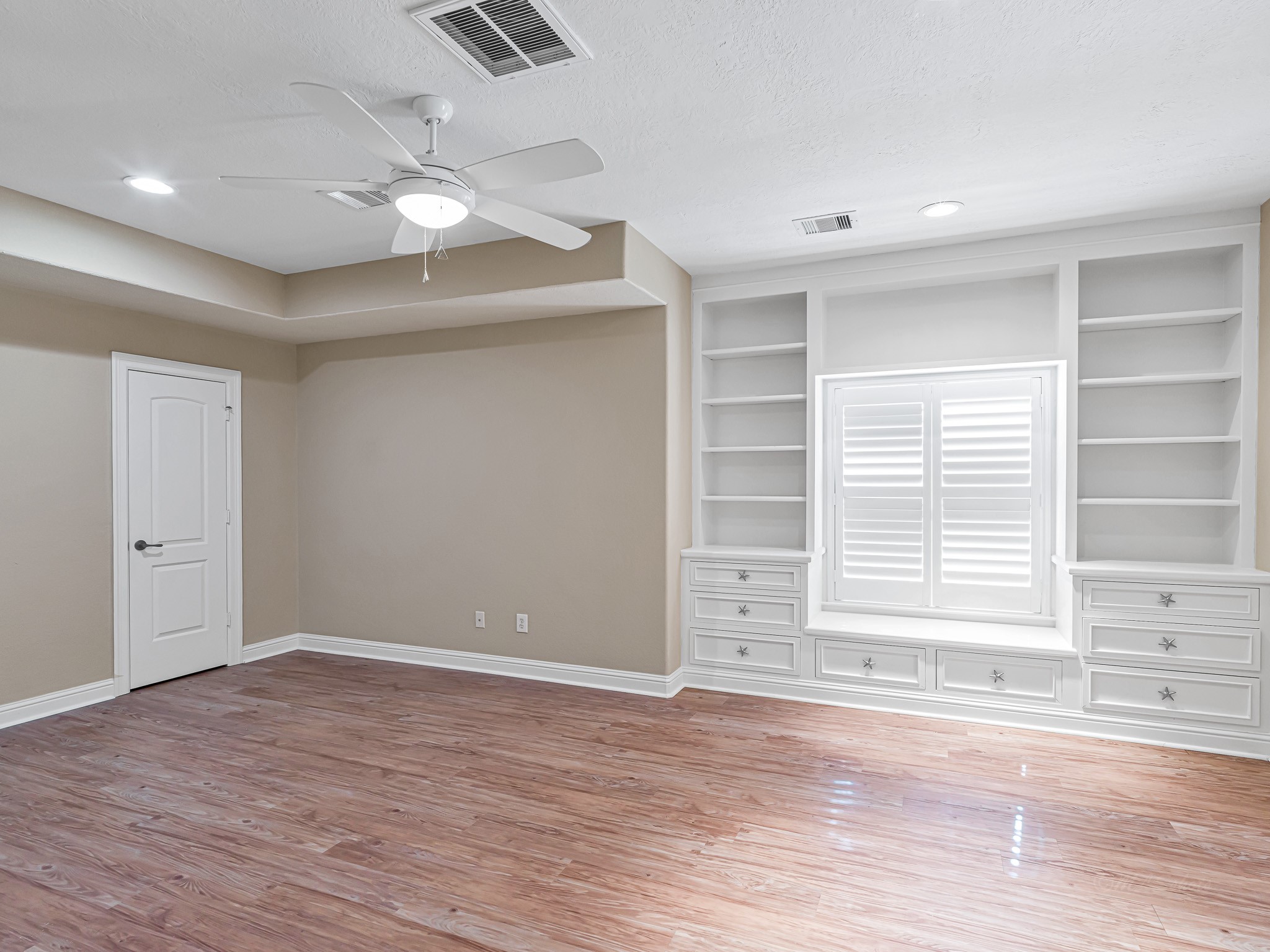1802 Sparrows Ridge Katy, TX 77450 - Photo 41 of 50 a view of an empty room with wooden floor and a window