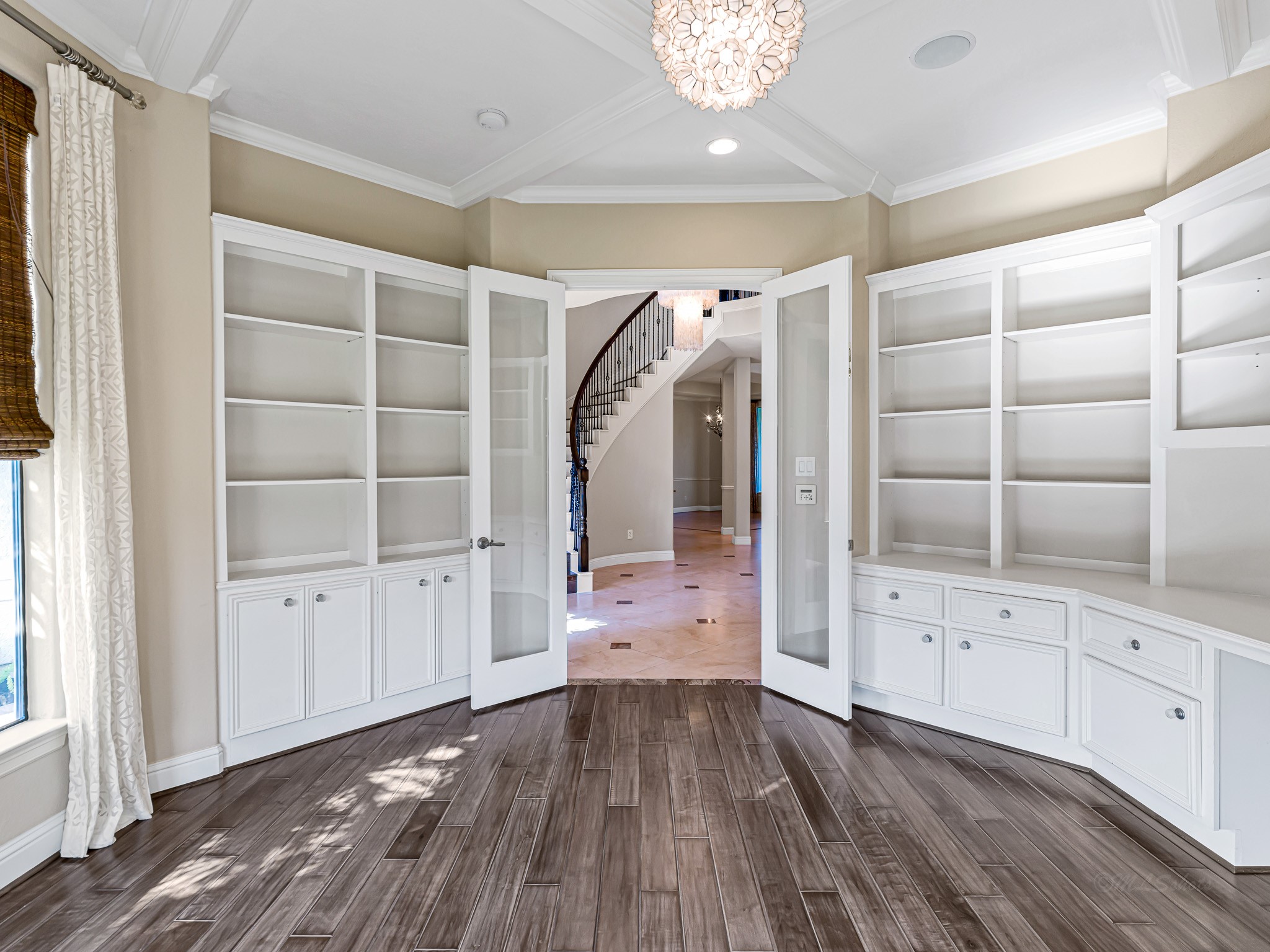 1802 Sparrows Ridge Katy, TX 77450 - Photo 7 of 50 a view of an empty room with wooden floor and cabinet