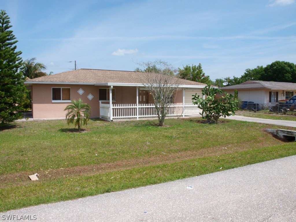 13034 First Street Fort Myers, FL 33905 - Photo 1 of 18 a house view with a garden space