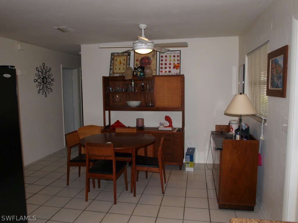 13034 First Street Fort Myers, FL 33905 - Photo 11 of 18 a view of a dining room with furniture