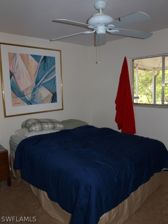13034 First Street Fort Myers, FL 33905 - Photo 12 of 18 a view of a bedroom with a bed