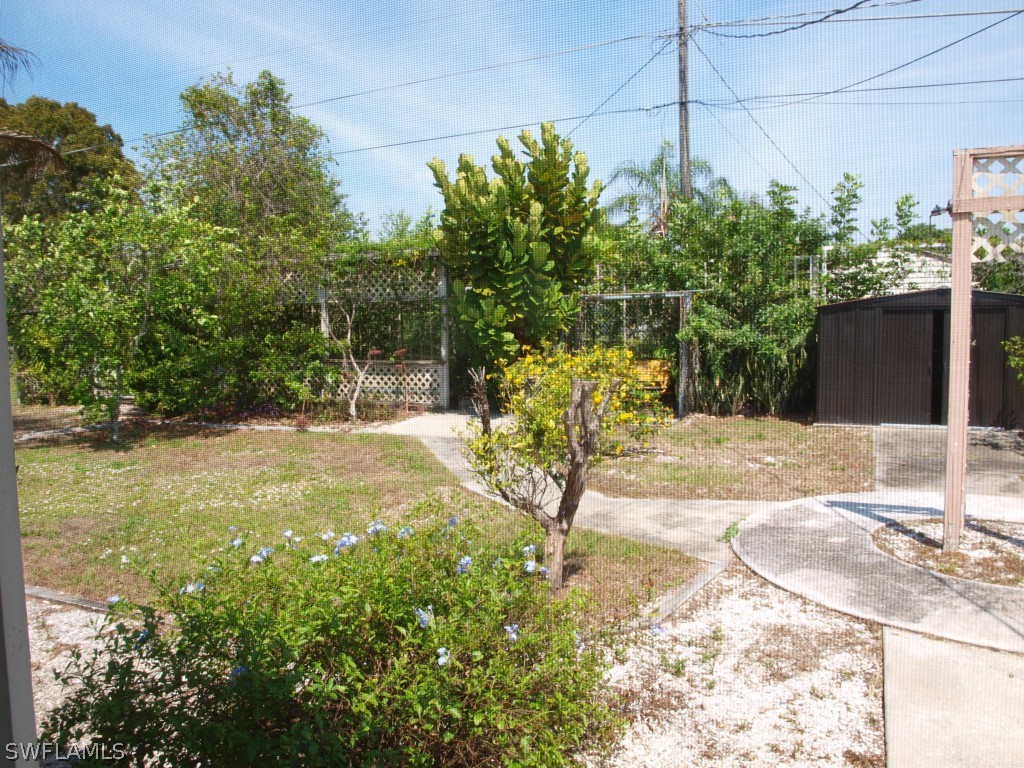 13034 First Street Fort Myers, FL 33905 - Photo 16 of 18 a view of a yard with plants