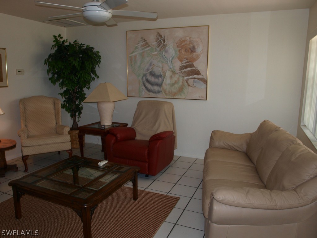 13034 First Street Fort Myers, FL 33905 - Photo 7 of 18 a living room with furniture and a potted plant
