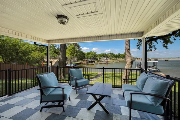 a view of a chair and table in the balcony