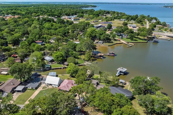 an aerial view of a house with a lake view