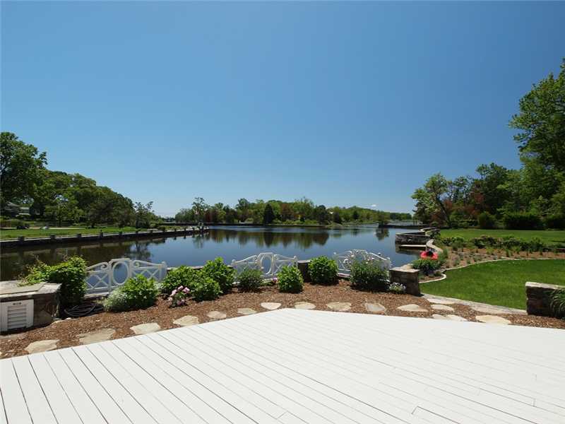 3 Coves End Road Darien, CT 06820 - Photo 16 of 22 a lake view with a bench next to a lake view